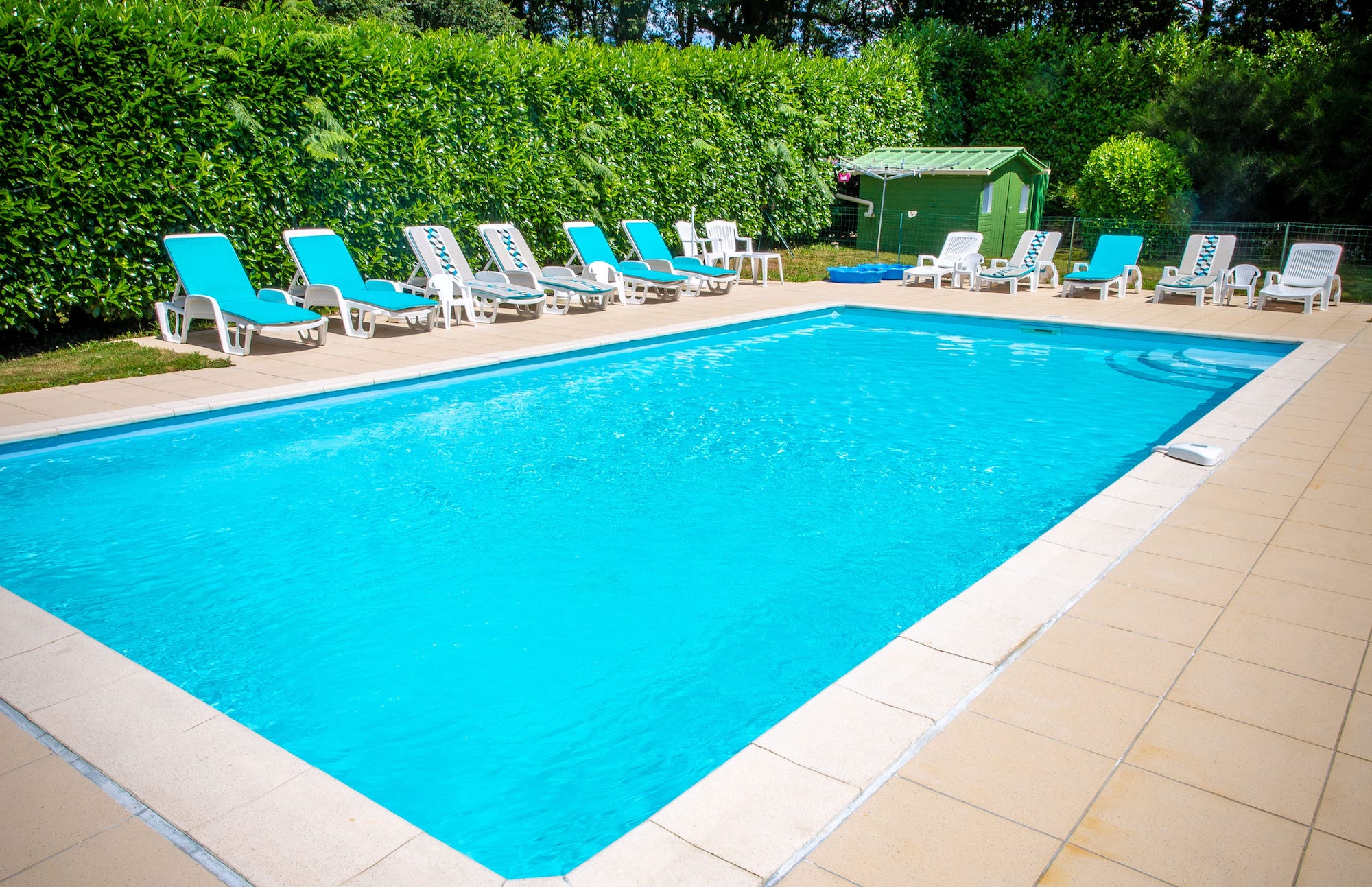 Sun Loungers beside our heated swimming pool 